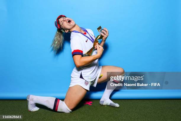 Julie Ertz of the USA poses with the Women's World Cup trophy after the 2019 FIFA Women's World Cup France Final match between The United State of...