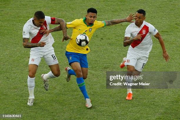 Gabriel Jesus of Brazil fights for the ball with Paolo Guerrero and Yoshimar Yotun of Peru during the Copa America Brazil 2019 Final match between...