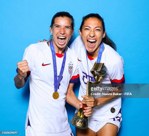 Tonin Heath and Christen Press of the USA pose with the Women's World Cup trophy after the 2019 FIFA Women's World Cup France Final match between The...