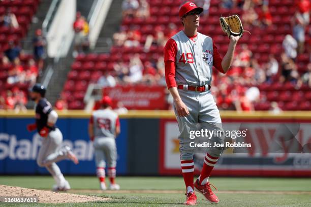 Jimmy Herget of the Cincinnati Reds reacts after giving up a two-run home run to Greg Allen of the Cleveland Indians in the eighth inning at Great...