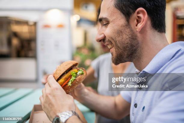 Man Rates Fast Food 2,806 Man Eating Fast Stock Photos, High-Res Pictures, and Images ...