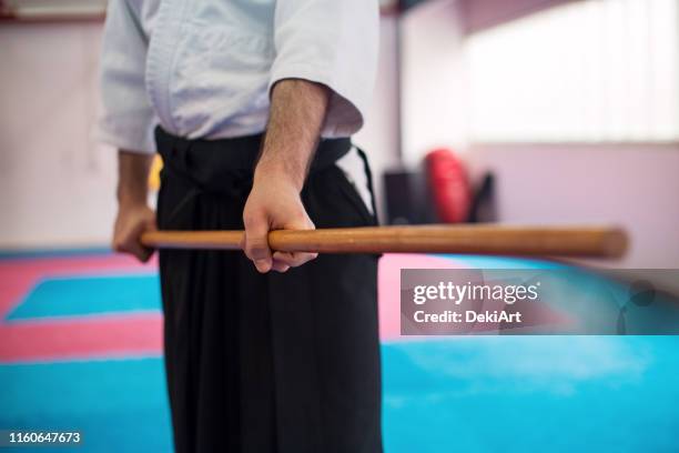 fighter in kimono holding  wooden sword - knife weapon stock pictures, royalty-free photos & images