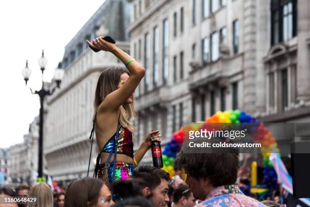 happy people celebrating at gay pride parade on streets of central london, uk - festival float stock pictures, royalty-free photos & images