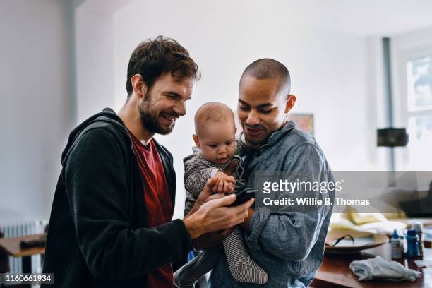 gay couple with their baby - b fotos - fotografias e filmes do acervo