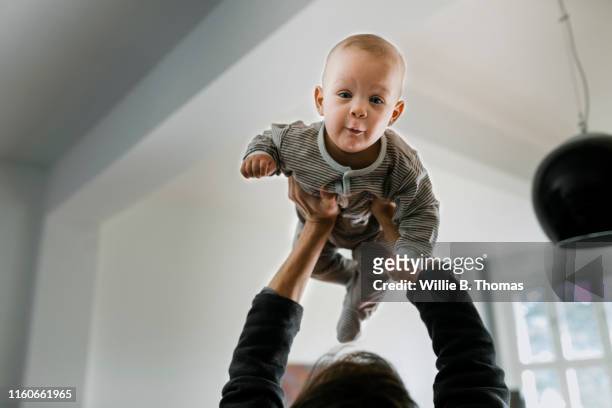 Close-up of Father lifting baby son