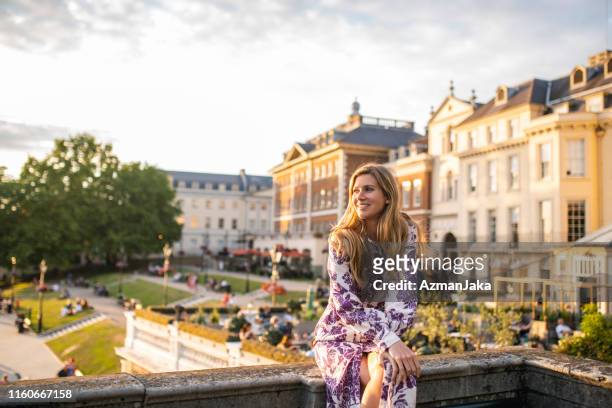 day dreaming mid adult caucasian woman on richmond bridge - richmond stock pictures, royalty-free photos & images