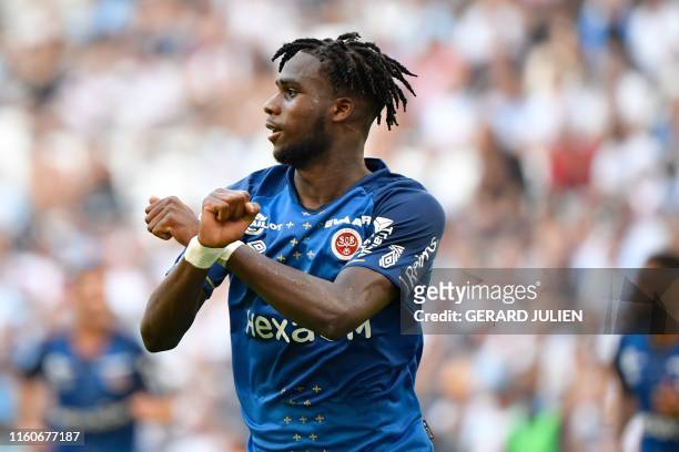 Reims' French forward Boulaye Dia celebrates after scoring a goal during the French L1 football match between Olympique de Marseille and Stade de...
