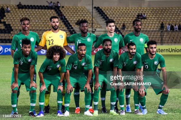 Saudi Arabia's starting eleven line up ahead of the 2019 West Asian Football Federation Championship group B match between Jordan and Saudi Arabia,...