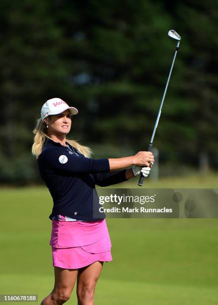 Carly Booth of Scotland plays her second shot at the 18th hole during the Aberdeen Standard Investment Scottish Open at The Renaissance Club on...