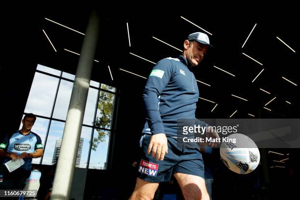 Blues coach Brad Fittler walks onto the field from the gym during a New South Wales Blues State of Origin training session at the NSWRL Centre of...