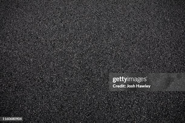 full frame shot of asphalt road - grano fuerte fotografías e imágenes de stock