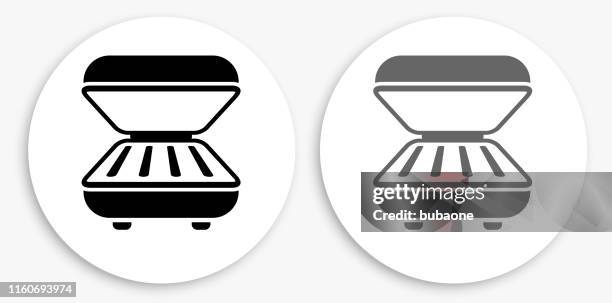 waffle maker black and white round icon - waffle maker stock illustrations