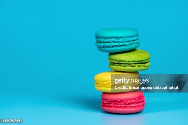 stacked colorful assorted macaroons, traditional french dessert.,macaroons - pile of candy stock-fotos und bilder