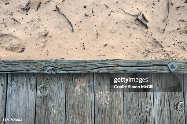 old wooden boardwalk over sand dune - boardwalk stock pictures, royalty-free photos & images