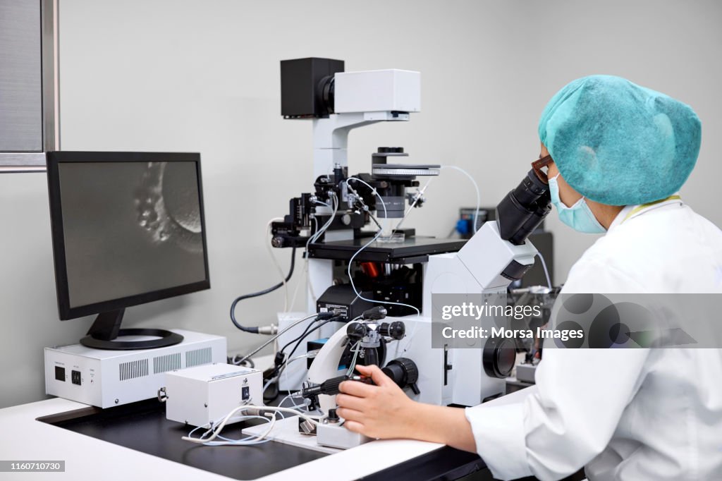 Female scientist conducting scientific experiment