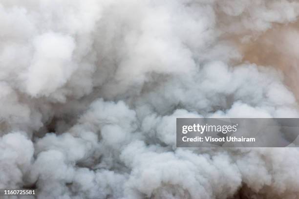 billowing black smoke from ignition midden. - pegajoso fotografías e imágenes de stock