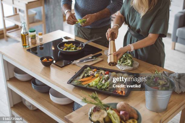 healthy family vegetables meal - healthy family cooking stock pictures, royalty-free photos & images