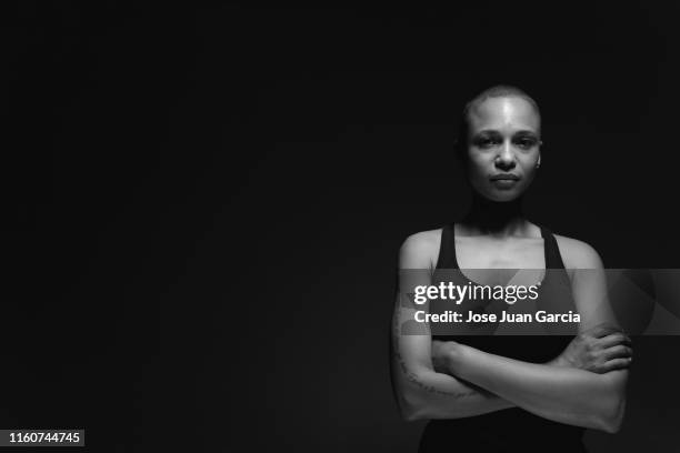 woman with shaved hair b&w - black and white portrait woman stock pictures, royalty-free photos & images