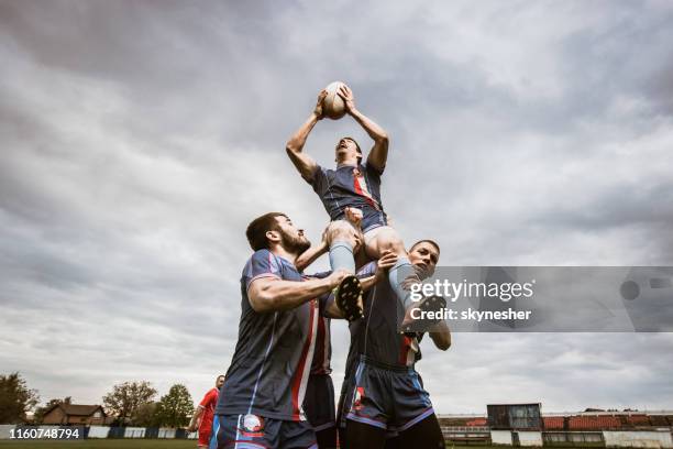 celebrating success on rugby field! - rugby union tournament imagens e fotografias de stock