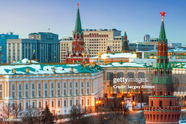 towers and state palace of the moscow kremlin - state kremlin palace stock-fotos und bilder