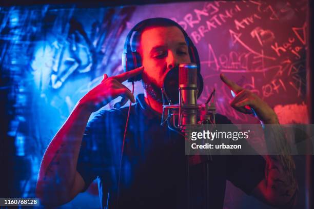 rap musician in studio - rapper stock pictures, royalty-free photos & images