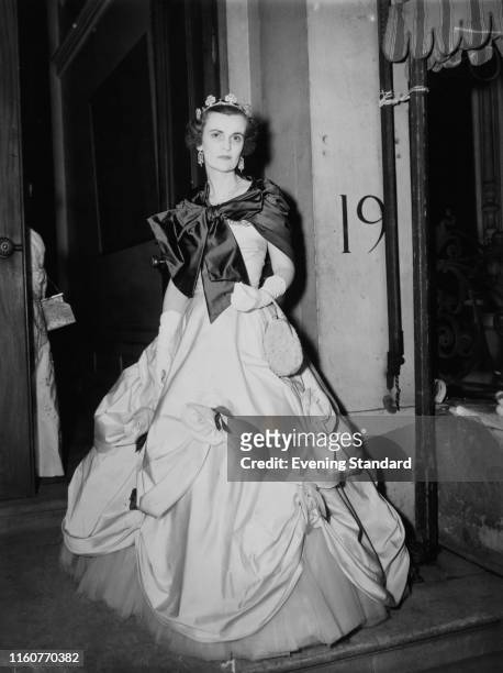 Margaret Campbell, Duchess of Argyll wearing an elaborate ballgown and tiara, 4th June 1953.