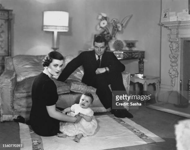 English socialite Margaret Sweeny , at home with her husband, Charles Sweeny , and their daughter, Frances, 28th January 1938. Margaret Sweeny later...