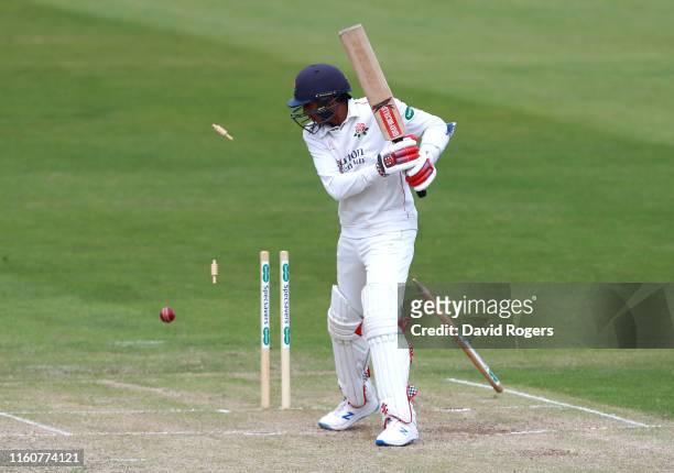 Haseeb Hameed of Lancashire is bowled by Ben Sanderson during the Specsavers County Championship division two match between Northamptonshire and...