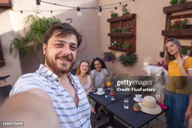 guy taking a selfie with his female friends - coffee moustache stock pictures, royalty-free photos & images