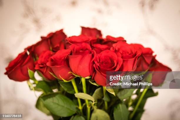 bunch of roses - rose arrangement stock pictures, royalty-free photos & images