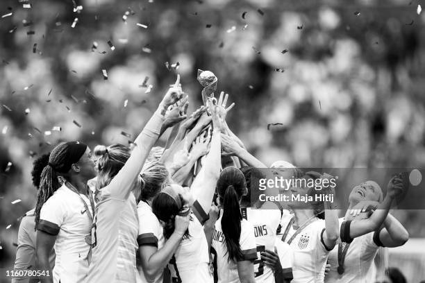 Players of the USA celebrate with the FIFA Women's World Cup Trophy following team's victory in the 2019 FIFA Women's World Cup France Final match...