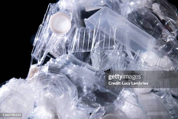 translucent plastic packaging closely stacked together - pvc stockfoto's en -beelden