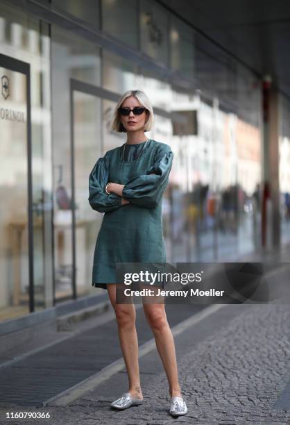 Lisa Hahnbück wearing Rhode dress, Tods shoes and Oliver Peoples sunglasses on July 01, 2019 in Berlin, Germany.