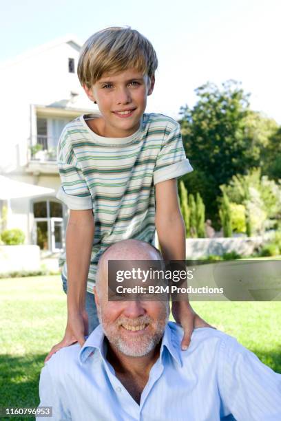 portrait of boy and grandfather in garden - 2010 2019 bildbanksfoton och bilder