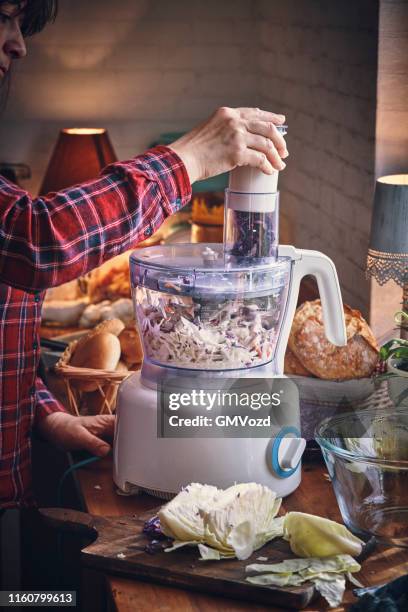 preparing cole slaw salad in domestic kitchen - coleslaw stock pictures, royalty-free photos & images
