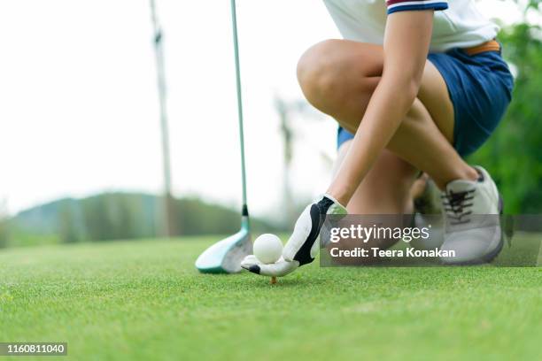 woman driving practice golf or trainer at golf course - women golf ストックフォトと画像