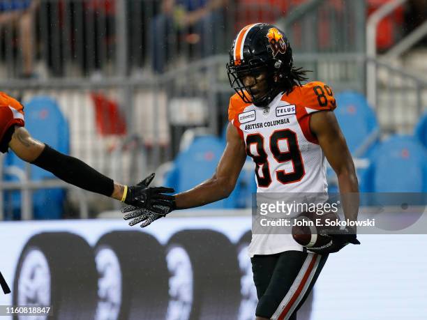 Duron Carter of the BC Lions gets congratulated during a game against the Toronto Argonauts at BMO Field on July 6, 2019 in Toronto, Canada. BC...