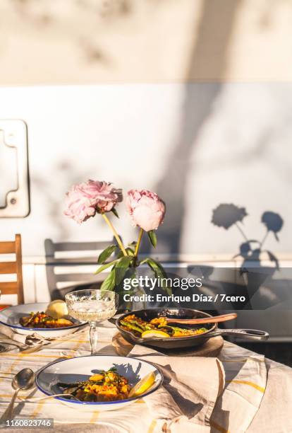 vegetable rice dinner outdoors with peony silhoutte - romantic picnic stockfoto's en -beelden