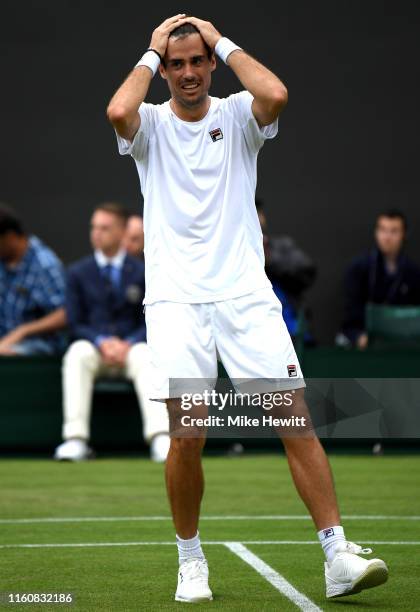 Guido Pella of Argentina celebrates victory following his Men's Singles fourth round match against Milos Raonic of Canada during Day Seven of The...