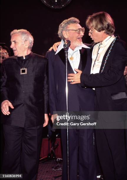 View of, from left, French-Armenian singer and diplomat Charles Aznavour , American singer and actor Frankie Laine , and American musician and actor...