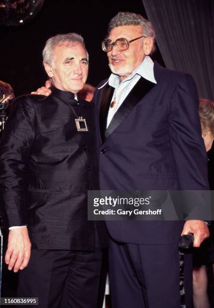 French-Armenian singer and diplomat Charles Aznavour and American singer and actor Frankie Laine pose together during the Songwriters Hall of Fame...