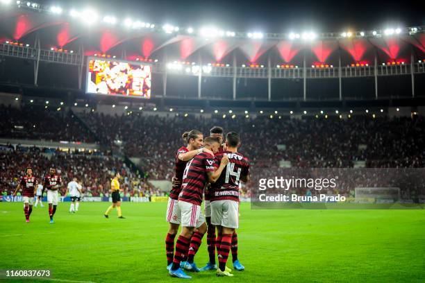 Giorgian De Arrascaeta of Flamengo celebrates with a teammates after scoring a goal during a match between Flamengo and Gremio as part of Brasileirao...