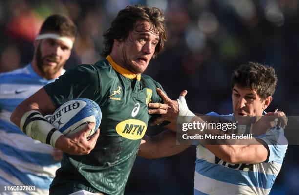 Franco Mostert of South Africa hands off Tomas Cubelli of Argentina during a match between Argentina and South Africa as part of The Rugby...