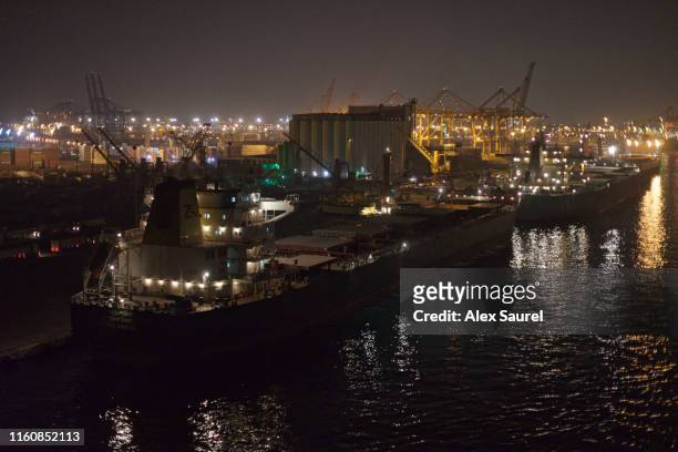 freighter boat docked in jeddah, saudi arabia - saudi arabia industry stock pictures, royalty-free photos & images