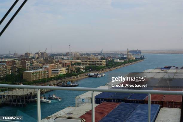 freighter boats entering suez canal, red sea, suez, egypt - canal do suez stock pictures, royalty-free photos & images