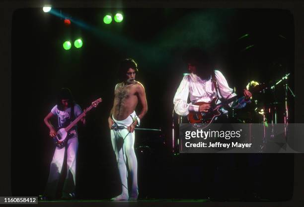 Musicians John Deacon, Freddie Mercury, Roger Taylor and Brian May of Queen perform in concert on December 18, 1977 at The Forum in Inglewood,...