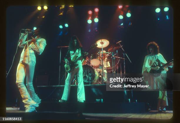 Musicians Freddie Mercury, John Deacon, Roger Taylor and Brian May of Queen perform in concert on March 2, 1977 at The Forum in Inglewood, California.