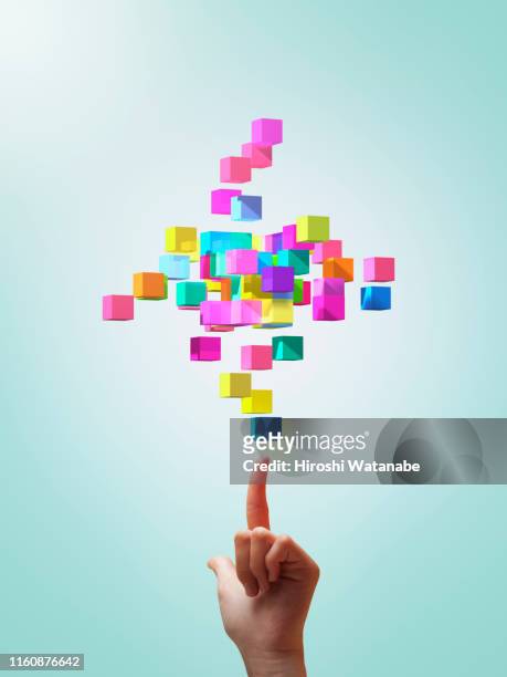 colorful cubes forming geometric shapes with girls hands - child picking up toys stock pictures, royalty-free photos & images