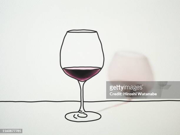 Wine poured into a wine glass drawn on drawing paper with shadow