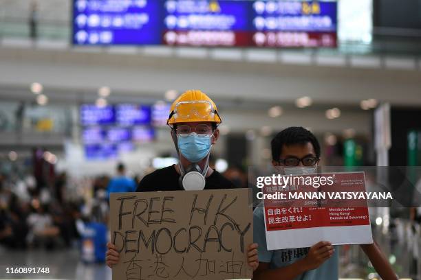 Pro-Democracy protesters gather against the controversial extradition bill at Hong Kong's international airport on August 11, 2019. - Empty hotel...